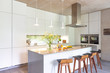 © Charlie Dean/Caia Image - Modern white kitchen with island