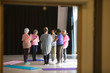 © Tom Merton/Caia Image - Serene active seniors practicing yoga in circle