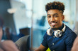 © Robert Daly/Caia Image - Portrait smiling, confident creative businessman with headphones
