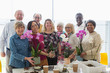 © Martin Barraud/Caia Image - Portrait smiling active seniors enjoying flower arranging class