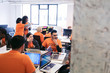 © Sam Edwards/Caia Image - Hackers coding for charity at hackathon