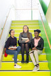 © Rob Daly/Caia Image - Portrait smiling, confident high school girls sitting on stairs