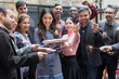 © Martin Barraud/Caia Image - Friends with sparklers celebrating with woman holding birthday cake