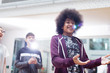 © Sam Edwards/Caia Image - Smiling teenage boy talking, gesturing in dance class studio