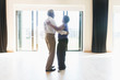© Tom Merton/Caia Image - Active senior couple dancing in dance studio