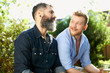 © Himalayan Pics/Caia Image - Male gay couple talking in garden