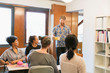 © Tom Merton/Caia Image - Creative businessman serving coffee and tea to colleagues