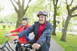 © Tom Merton/Caia Image - Active senior couple riding bikes in park