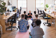 © Tom Merton/Caia Image - Creative business people meditating in office