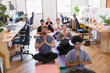 © Tom Merton/Caia Image - Creative business people meditating in office