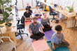 © Tom Merton/Caia Image - Serene creative business people meditating in office