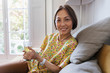 © Tom Merton/Caia Image - Portrait confident senior woman drinking tea in living room