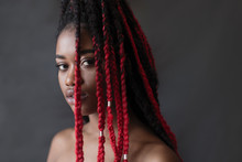 Portrait Confident, Serious Young Woman With Red Braids