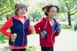 © Robert Daly/Caia Image - Active senior women friends jogging with hand weights in park