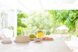 © Charlie Dean/Caia Image - Lemonade and grapes on summer patio table