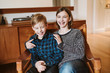 © Jarusha Brown/Caia Image - Portrait laughing tween brother and sister