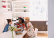 © Tom Merton/Caia Image - Young women friends enjoying breakfast at dining table