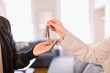 © Tom Merton/Caia Image - Real estate agent giving keys to homeowner