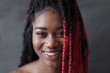 © Sam Edwards/Caia Image - Portrait smiling, confident young woman with red braid