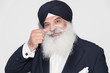 © Sam Edwards/Caia Image - Portrait confident senior man with white beard wearing turban