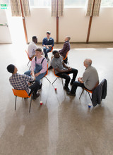 Men Talking In Group Therapy
