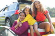 © Sam Edwards/Caia Image - Portrait happy mother and daughters camping