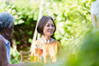 © Tom Merton/Caia Image - Senior friends enjoying garden party