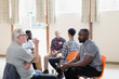 © Tom Merton/Caia Image - Men talking in group therapy