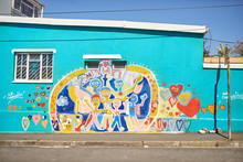 Vibrant Community Mural On Sunny Urban Wall