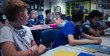 © Robert Daly/Caia Image - Junior high school students at desks in classroom