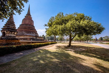 Background, the landmark of the Buddhist tourist attraction in Sukhothai Historical Park, tourists all over the world come to see the beauty always in Thailand.