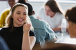 © Chris Ryan/Caia Image - Happy, smiling high school girl student talking with classmate in classroom