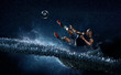 © Rana Dias/Caia Image - Male soccer player kicking soccer ball against futuristic background