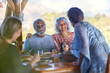 © Trevor Adeline/Caia Image - Happy senior couple enjoying breakfast on yoga retreat