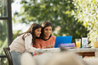 © Tom Merton/Caia Image - Mother and daughter using laptop