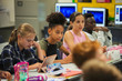 © Paul Bradbury/Caia Image - Focused junior high school girl student listening in classroom