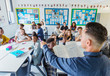 © Chris Ryan/Caia Image - High school teacher calling on students during lesson in classroom