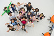 © Robert Daly/Caia Image - Portrait from above of enthusiastic junior high students teachers cheering