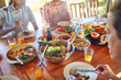© Trevor Adeline/Caia Image - Friends eating healthy meal during yoga retreat