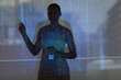 © Tom Merton/Caia Image - Businesswoman leading meeting at projection screen with binary code