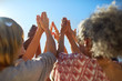 © Trevor Adeline/Caia Image - Group with hands clasped in circle during yoga retreat