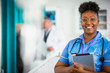 © Chris Ryan/Caia Image - Portrait confident female nurse with digital tablet
