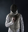© Rana Dias/Caia Image - Portrait man in fencing uniform and mask