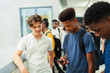© Paul Bradbury/Caia Image - Junior high students using smart phone