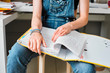 © Paul Viant/Caia Image - Young female college student with binder studying