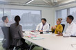 © Tom Merton/Caia Image - Doctors and administrators talking in conference room meeting