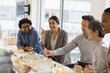 © Tom Merton/Caia Image - Happy business people enjoying sushi lunch