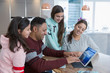 © Chris Ryan/Caia Image - Family using digital tablet at kitchen table