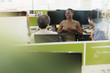 © Tom Merton/Caia Image - Business people talking in open plan office