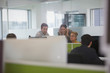 © Tom Merton/Caia Image - Business people meeting at computer in open plan office